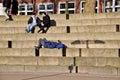 On a ladder resting unknown people. Royalty Free Stock Photo