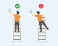 Ladder safety rules. Man painting wall with paint roller on a ladder. Royalty Free Stock Photo