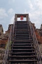 The ladder, sky and the sign Stop framed vertical in Angkor temple Royalty Free Stock Photo