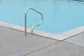 Ladder steel of corner blue swimming pool Royalty Free Stock Photo