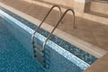 Ladder in swimming pool