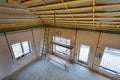 Ladder and trestle scaffolds in the house building that is under remodeling, renovation, extension, restoration