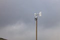 Blade type or Windmill type anemometer on top of the pole, install near crater of volcano Royalty Free Stock Photo