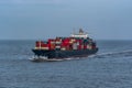 Laden cargo container vessel passes underway through rough Yellow sea near Shanghai Royalty Free Stock Photo