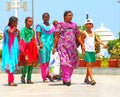 Ladies and boy walking with traditional costumes india