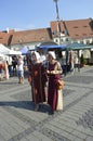 Ladies dressed in medieval dresses,