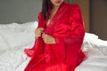 Ladies in erotic silk nightwear and a luxurious long robe.