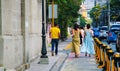 Ladies in gowns walking on the street