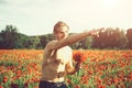 Ladies` man. muscular man in field of red poppy seed Royalty Free Stock Photo