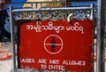 Ladies are not allowed to enter` - Red sign show women are not allowed to pray and enter holy buddhist area