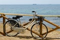 Ladies retro city bike at seashore