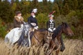 Ladies in 19th century dress riding horses