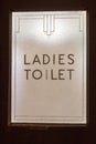 Ladies toilet sign on door glass in art deco style Royalty Free Stock Photo