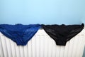 Ladies underwear drying on a radiator Royalty Free Stock Photo