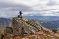 Ladinger Spitz - Man with a hiking backpack on a massive rock on summit Gertrusk on the way near Ladinger Spitz, Saualpe Royalty Free Stock Photo