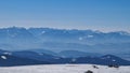 Ladinger Spitz - Panoramic view on snowcapped mountain ranges of Karawanks and Kamnik Savinja Alps in winter seen from Saualpe