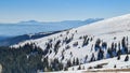 Ladinger Spitz - Scenic view of snow covered alpine meadows hills and forest seen from Ladinger Spitz, Saualpe, Lavanttal Alps, Royalty Free Stock Photo