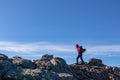 Ladinger Spitz - Woman with backpack and jacket hiking on rock formations from Ladinger Spitz to Gertrusk, Saualpe Royalty Free Stock Photo