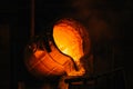 Ladle container with molten metal. Cast iron melting Royalty Free Stock Photo