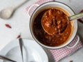 A ladle full with delicious bean, beef stew from above