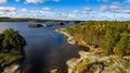 Ladoga lake, blue sky and autumn forest Royalty Free Stock Photo