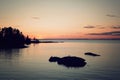 Ladoga lake at sunset. Aged photo in retro style. Royalty Free Stock Photo