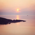 Ladoga lake at sunset. Calm water. A boat on the horizon. Royalty Free Stock Photo