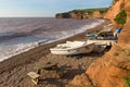 Ladram Bay beach Devon England UK with boats red sandstone rock Jurassic coast Royalty Free Stock Photo