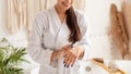 Lady Applying Hands Cream Moisturizing Skin In Bathroom, Cropped, Panorama