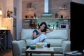 Lady asleep on sofa alone in living room