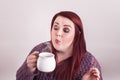 Lady blowing steam from hot cup of coffee Royalty Free Stock Photo