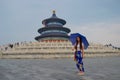 Lady with blue trousers and blue umbrella in front of Blue Temple of Heaven, China Royalty Free Stock Photo