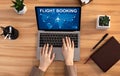 Lady Booking Flight Using Laptop Sitting At Desk Indoor, Above-View