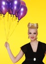 lady with a bunch of purple balloons Royalty Free Stock Photo