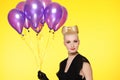 lady with a bunch of purple balloons Royalty Free Stock Photo