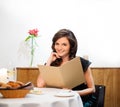 Lady choosing food in restaurant