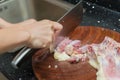 Lady chopping chicken Royalty Free Stock Photo