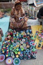 The lady with colourful clay pots Royalty Free Stock Photo