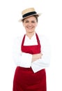 Lady cook in white red uniform wearing hat Royalty Free Stock Photo