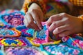 lady crocheting colorful granny squares for a quilt