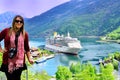 Lady with Cruise Ship on Norwegian Fjord Royalty Free Stock Photo