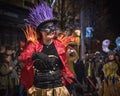 Lady dancing and wearing a ring masters costume, while leading the parade at the annual festial of light