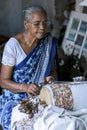 A lady demonstrates how to weave a tapestry at the Galle Fort Museum in Galle, Sri Lanka.