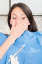 Lady in dentist chair being scared about anesthetic needle Royalty Free Stock Photo