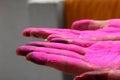 A lady displaying colured palm during holi festival in india