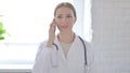 Lady Doctor Talking on Phone with Patient Royalty Free Stock Photo