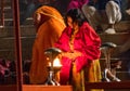 A lady doing prayer in assi ghaat