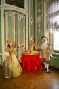 A lady-drink, a Girl table, Living table and actors and animators in costumes of the Rococo period. Royalty Free Stock Photo