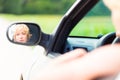 Lady driving a car.