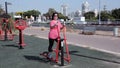Lady exercises on elliptical cross